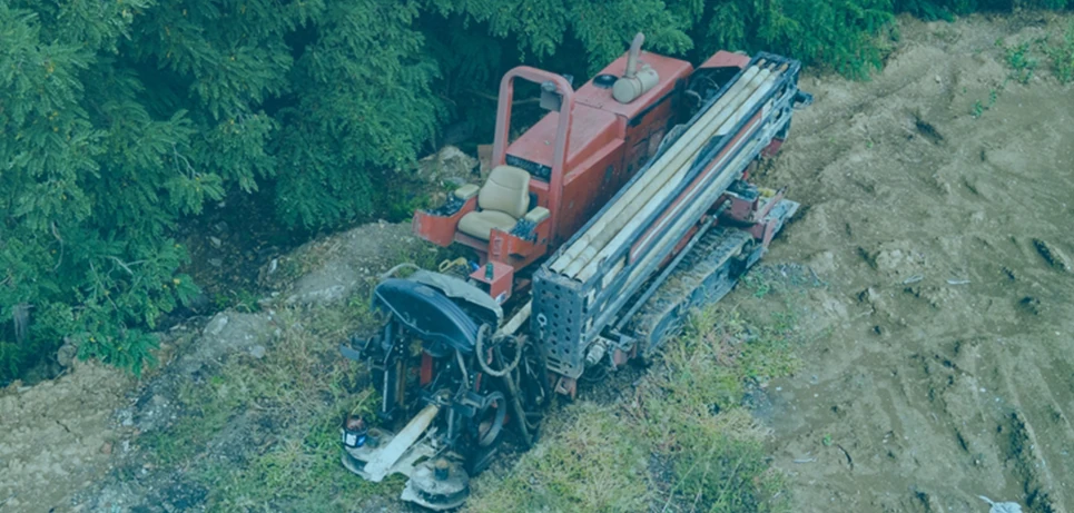 Aerial top-down view of heavy compact directional drilling track rig setup